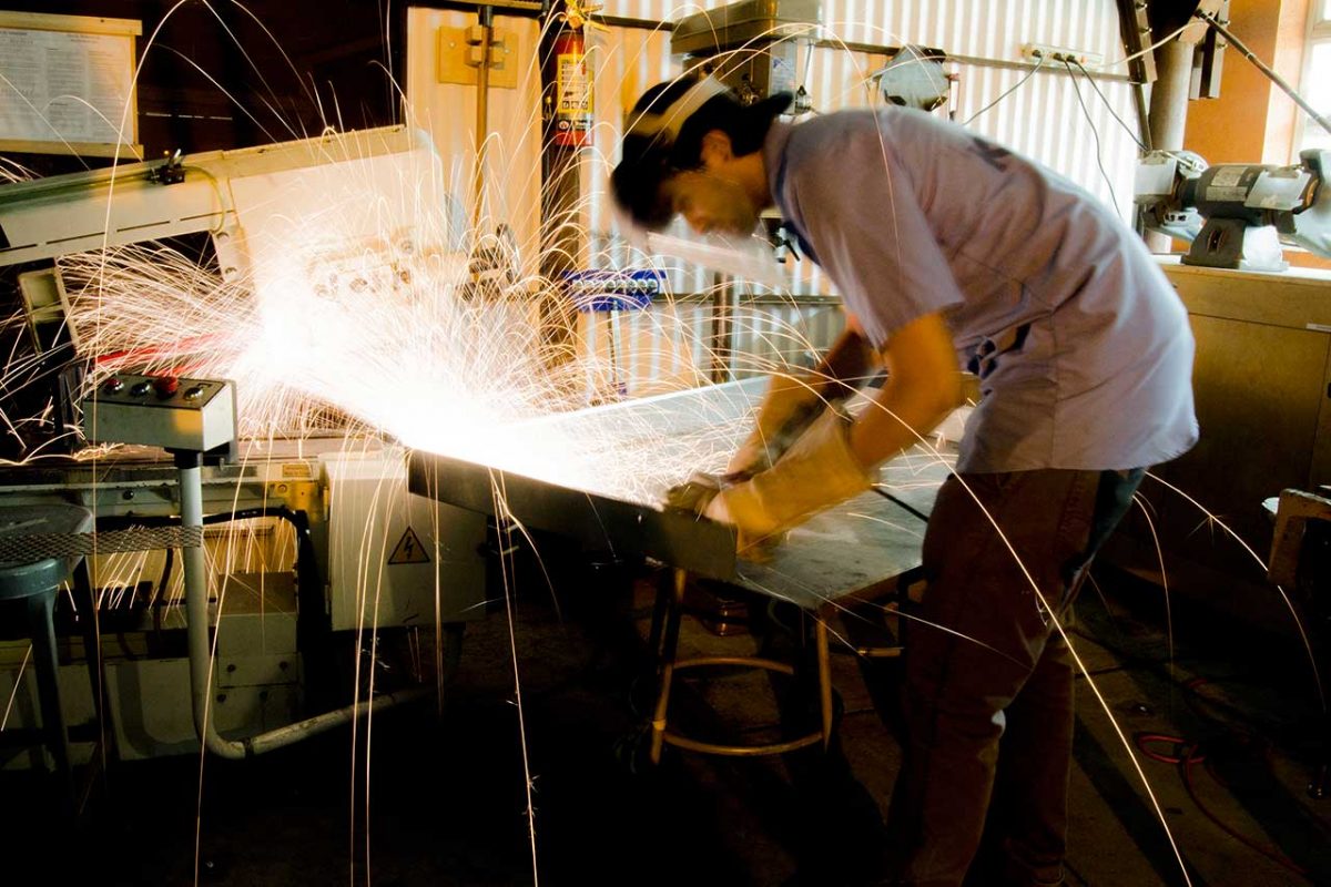 San Diego architecture student constructing a model building out of sheet metal