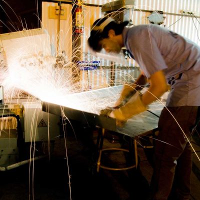 San Diego architecture student constructing a model building out of sheet metal