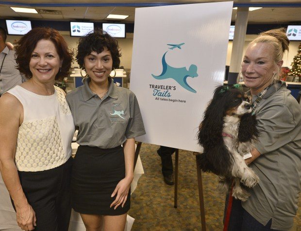 Professor Cate Roman and student Samm Deboda stand with Candy Malatesta and her comfort dog Miss Sherman Oaks. 