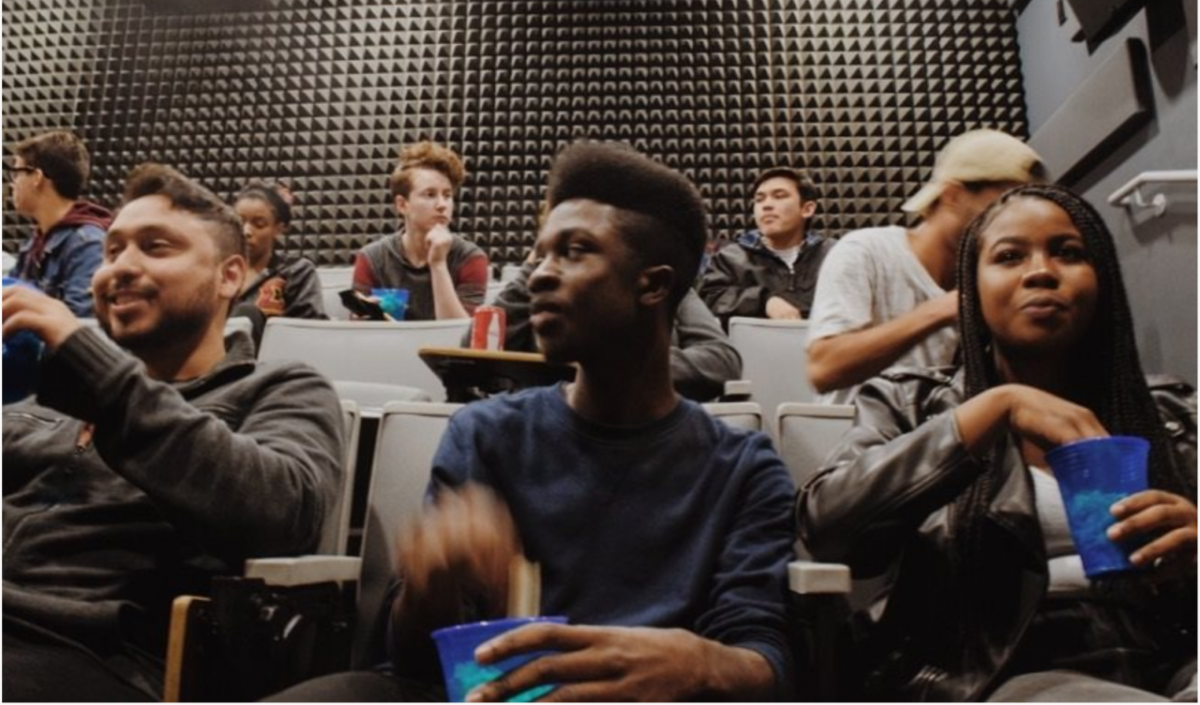 students sitting in a lecturing room.